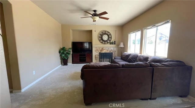 37016 Sabal Ave, Palmdale, CA 93552 - carpeted living area with a tiled fireplace, baseboards, and ceiling fan