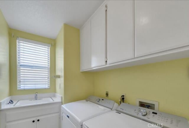 49 El Cencerro, Rancho Santa Margarita, CA 92688 - clothes washing area with plenty of natural light, a sink, cabinet space, and washing machine and dryer