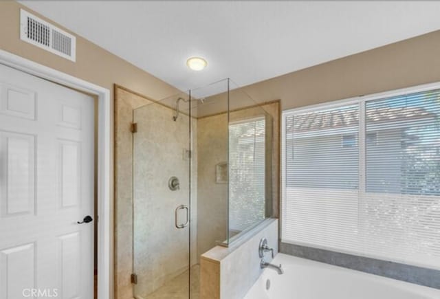 49 El Cencerro, Rancho Santa Margarita, CA 92688 - full bathroom with a garden tub, a stall shower, and visible vents