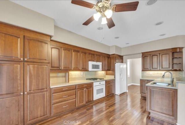 49 El Cencerro, Rancho Santa Margarita, CA 92688 - kitchen featuring open shelves, a sink, white appliances, decorative backsplash, and wood finished floors