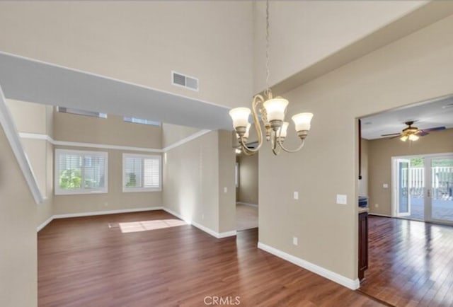 49 El Cencerro, Rancho Santa Margarita, CA 92688 - interior space featuring baseboards, ceiling fan with notable chandelier, wood finished floors, and visible vents