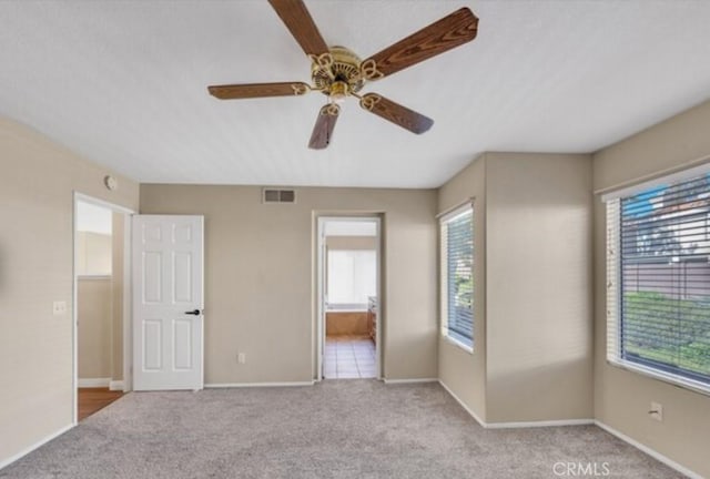 49 El Cencerro, Rancho Santa Margarita, CA 92688 - unfurnished bedroom with visible vents, connected bathroom, baseboards, and carpet floors