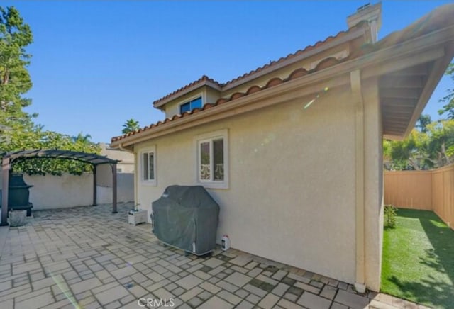 49 El Cencerro, Rancho Santa Margarita, CA 92688 - view of patio / terrace featuring a fenced backyard, a pergola, and a grill