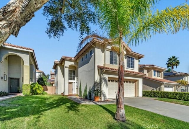 49 El Cencerro, Rancho Santa Margarita, CA 92688 - mediterranean / spanish home with a garage, a front yard, stucco siding, driveway, and a tile roof
