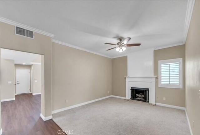 49 El Cencerro, Rancho Santa Margarita, CA 92688 - unfurnished living room with ornamental molding, a fireplace with raised hearth, ceiling fan, and visible vents