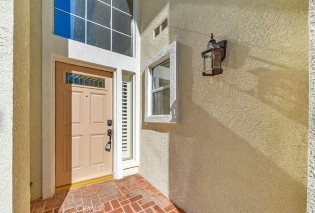 49 El Cencerro, Rancho Santa Margarita, CA 92688 - property entrance featuring visible vents and stucco siding
