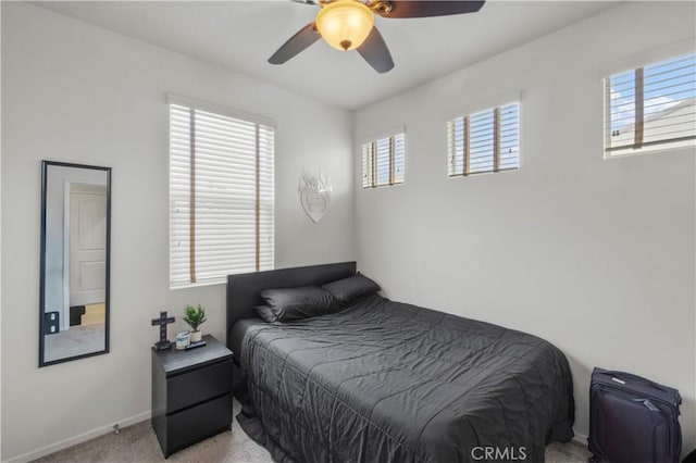 4250 W 5th St, Santa Ana, CA 92703 - bedroom featuring a ceiling fan, baseboards, and light carpet