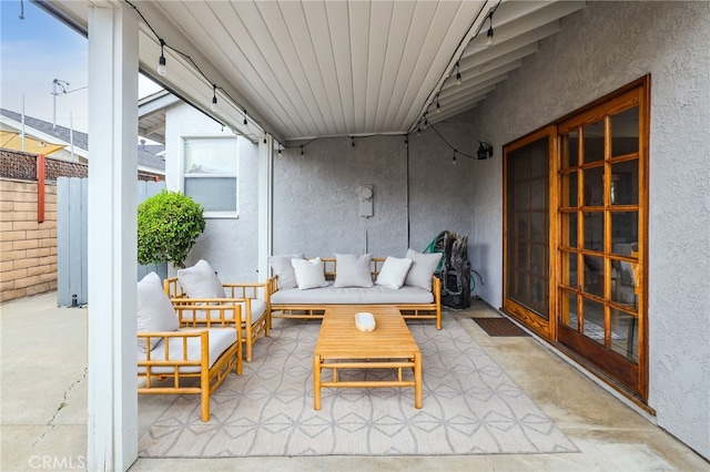 view of patio with fence and an outdoor hangout area
