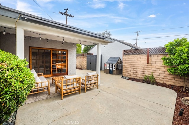 view of patio featuring an outdoor hangout area and a fenced backyard