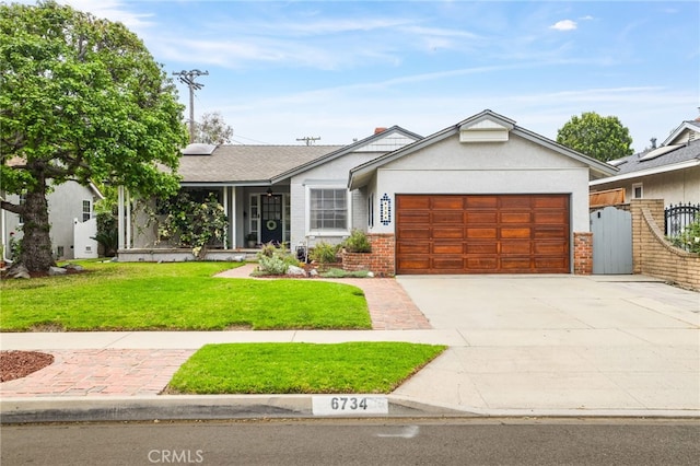ranch-style home with a front lawn, driveway, a garage, stucco siding, and brick siding