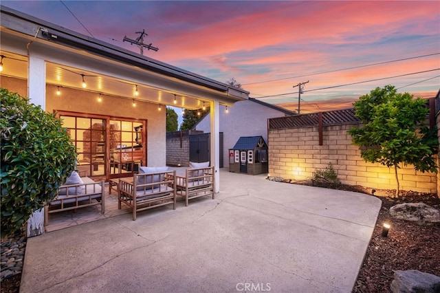 view of patio / terrace featuring fence and an outdoor hangout area