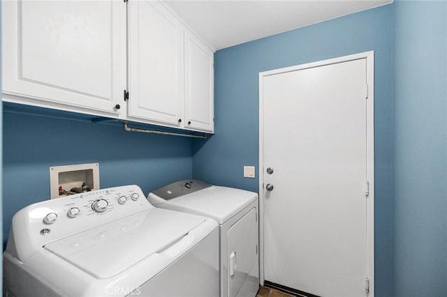 washroom featuring washer and dryer and cabinet space