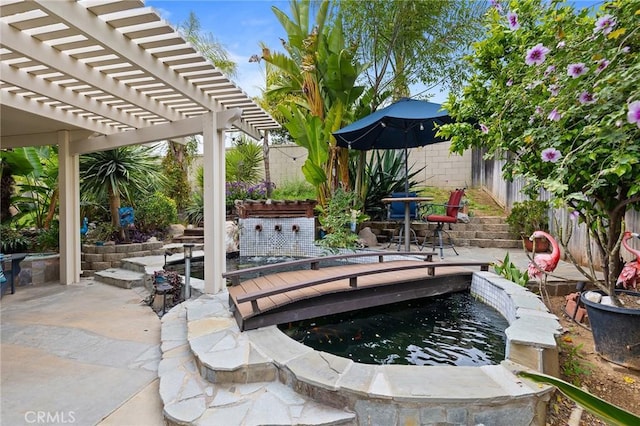view of patio featuring a fenced backyard and a pergola