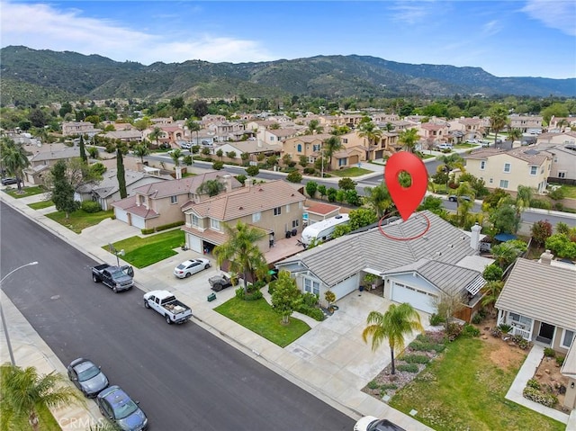 bird's eye view featuring a residential view and a mountain view