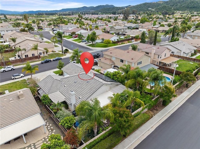 birds eye view of property with a mountain view and a residential view