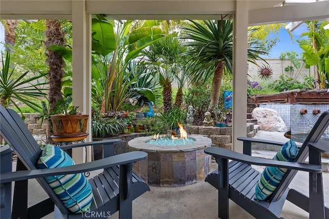 view of patio / terrace with an outdoor fire pit