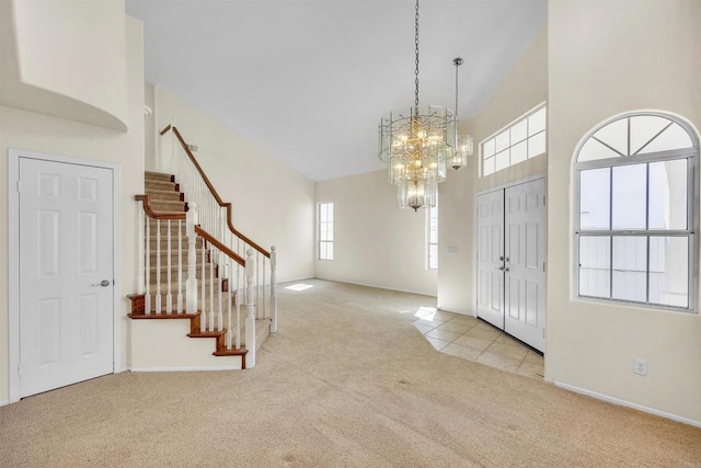 6017 Piros Way, Oceanside, CA 92056 - carpeted entrance foyer with a towering ceiling, baseboards, stairs, and a notable chandelier