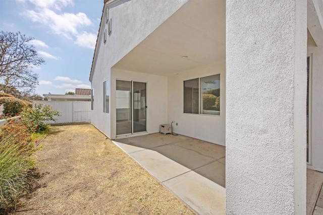 6017 Piros Way, Oceanside, CA 92056 - back of property with a patio, fence, and stucco siding