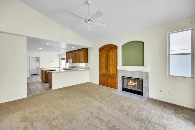 6017 Piros Way, Oceanside, CA 92056 - unfurnished living room with light carpet, a fireplace, a ceiling fan, recessed lighting, and vaulted ceiling