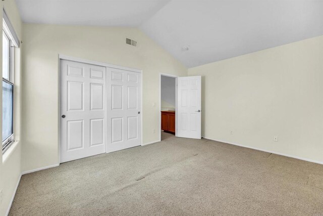 6017 Piros Way, Oceanside, CA 92056 - unfurnished bedroom featuring baseboards, visible vents, carpet, and vaulted ceiling