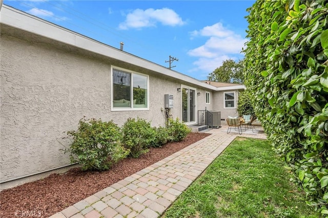 4301 W 138th St, Hawthorne, CA 90250 - back of house with stucco siding, a patio area, and central AC