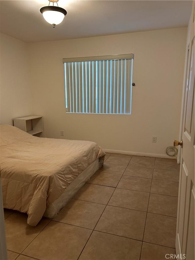tiled bedroom with baseboards