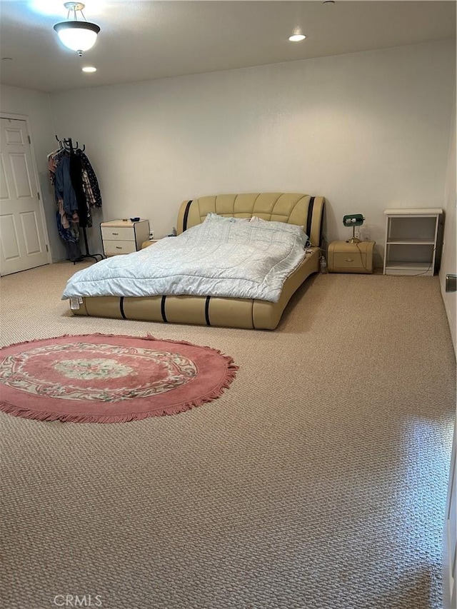 carpeted bedroom featuring recessed lighting