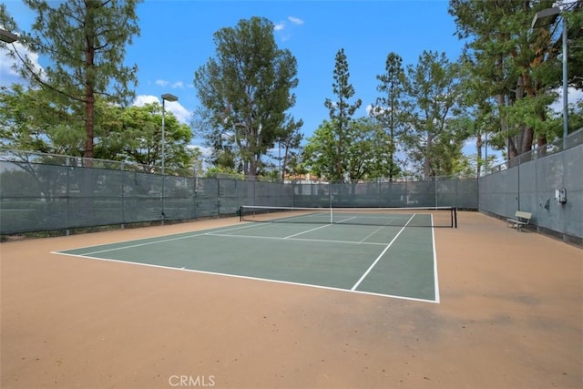 view of sport court with fence and community basketball court