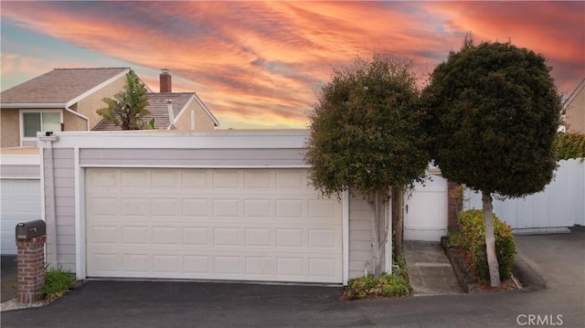 33601 Via Corvalian Unit 4, Dana Point, CA 92629 - garage at dusk with driveway
