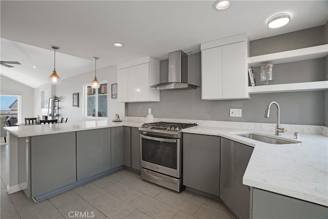 33601 Via Corvalian Unit 4, Dana Point, CA 92629 - kitchen featuring stainless steel range with gas cooktop, open shelves, a sink, wall chimney range hood, and a peninsula