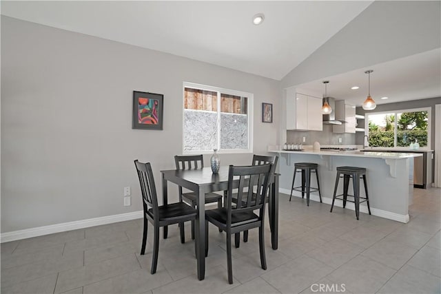 33601 Via Corvalian Unit 4, Dana Point, CA 92629 - dining room featuring recessed lighting, baseboards, lofted ceiling, and light tile patterned flooring