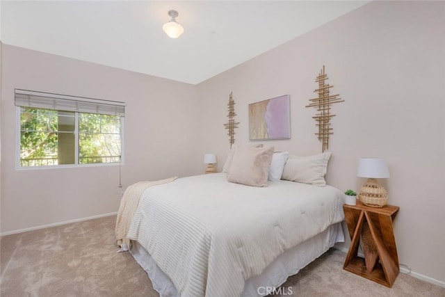 carpeted bedroom with baseboards