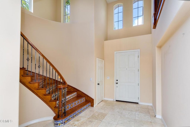 5018 Via Andrea, Newbury Park, CA 91320 - foyer featuring baseboards, a high ceiling, and stairs