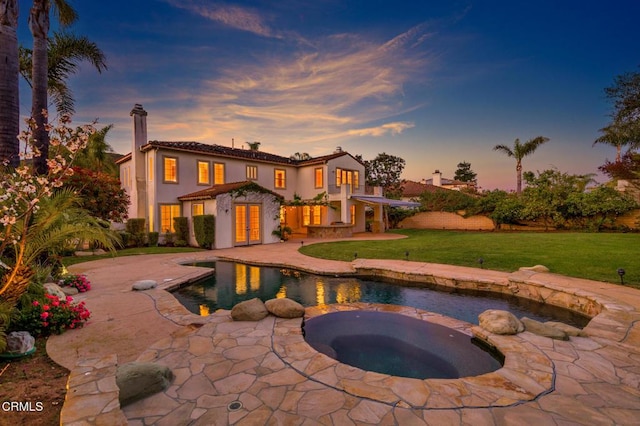 5018 Via Andrea, Newbury Park, CA 91320 - back of house with an in ground hot tub, french doors, a lawn, an outdoor pool, and a patio