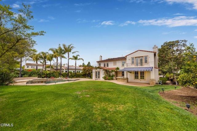 5018 Via Andrea, Newbury Park, CA 91320 - back of property with french doors, a chimney, a yard, and a patio area