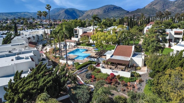 6755 Caminito Del Greco, San Diego, CA 92120 - aerial view of property and surrounding area featuring a mountain backdrop, nearby suburban area, and a pool