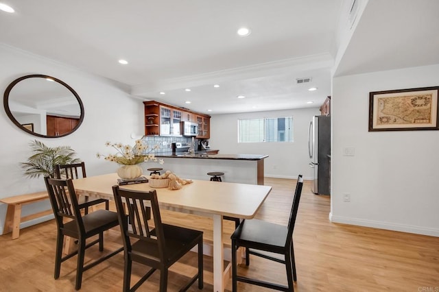 6755 Caminito Del Greco, San Diego, CA 92120 - dining area with recessed lighting, baseboards, light wood-style flooring, and ornamental molding
