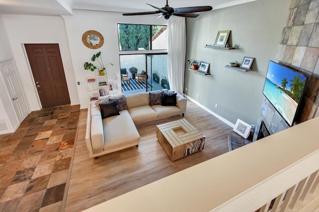6755 Caminito Del Greco, San Diego, CA 92120 - living area with crown molding, a ceiling fan, and baseboards