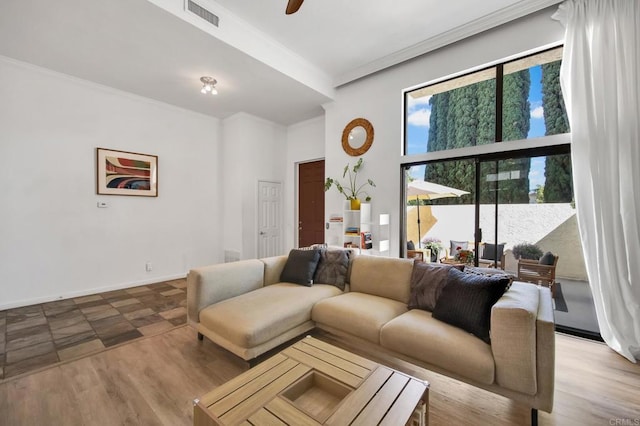 6755 Caminito Del Greco, San Diego, CA 92120 - living area featuring crown molding, a ceiling fan, a towering ceiling, and baseboards