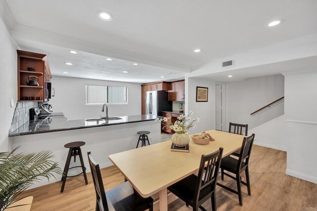 6755 Caminito Del Greco, San Diego, CA 92120 - dining space with recessed lighting, light wood finished floors, and baseboards
