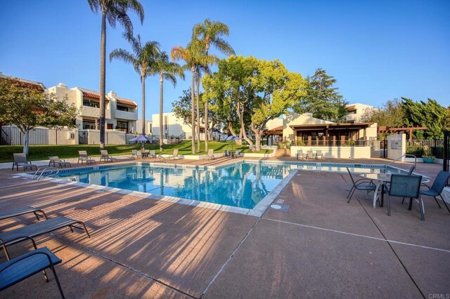 6755 Caminito Del Greco, San Diego, CA 92120 - community pool with a patio area, fence, and a residential view