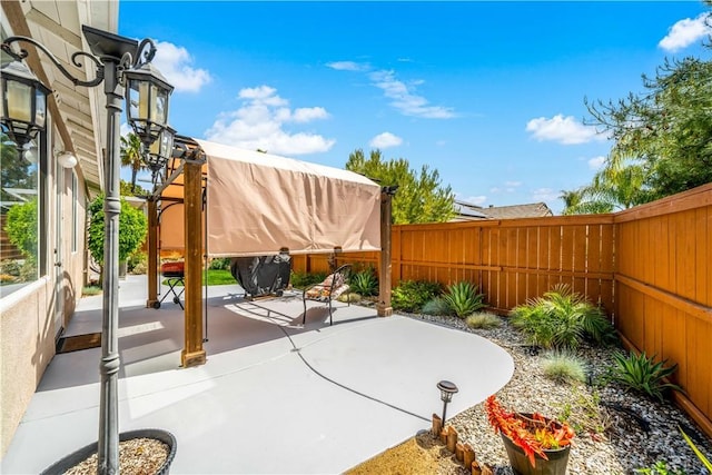 view of patio with a fenced backyard