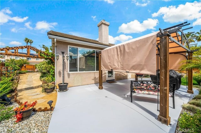 view of patio / terrace featuring fence