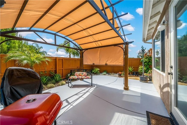 view of patio / terrace featuring a fenced backyard and a grill