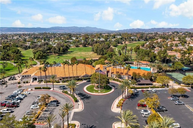 drone / aerial view featuring a mountain view and golf course view