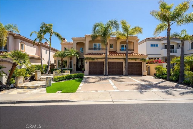 12 Santa Barbara Pl, Laguna Niguel, CA 92677 - mediterranean / spanish-style home featuring driveway, a tiled roof, stucco siding, and an attached garage