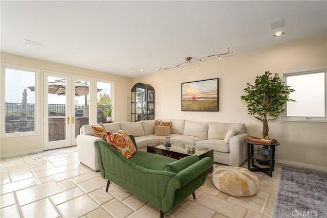 12 Santa Barbara Pl, Laguna Niguel, CA 92677 - living area with recessed lighting, arched walkways, rail lighting, baseboards, and french doors