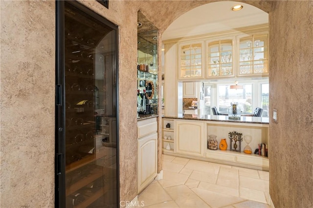 12 Santa Barbara Pl, Laguna Niguel, CA 92677 - bar featuring stone tile floors, recessed lighting, and arched walkways