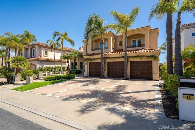 12 Santa Barbara Pl, Laguna Niguel, CA 92677 - mediterranean / spanish home with concrete driveway, a garage, stucco siding, and a tiled roof