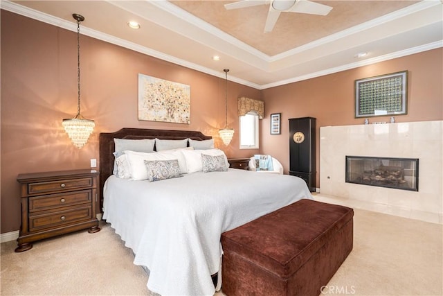 12 Santa Barbara Pl, Laguna Niguel, CA 92677 - bedroom with a tile fireplace, ornamental molding, a tray ceiling, and carpet flooring